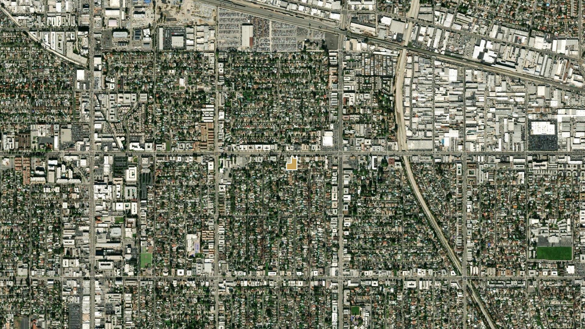 Aerial of the Sherman Way corridor in Van Nuys with the site marked