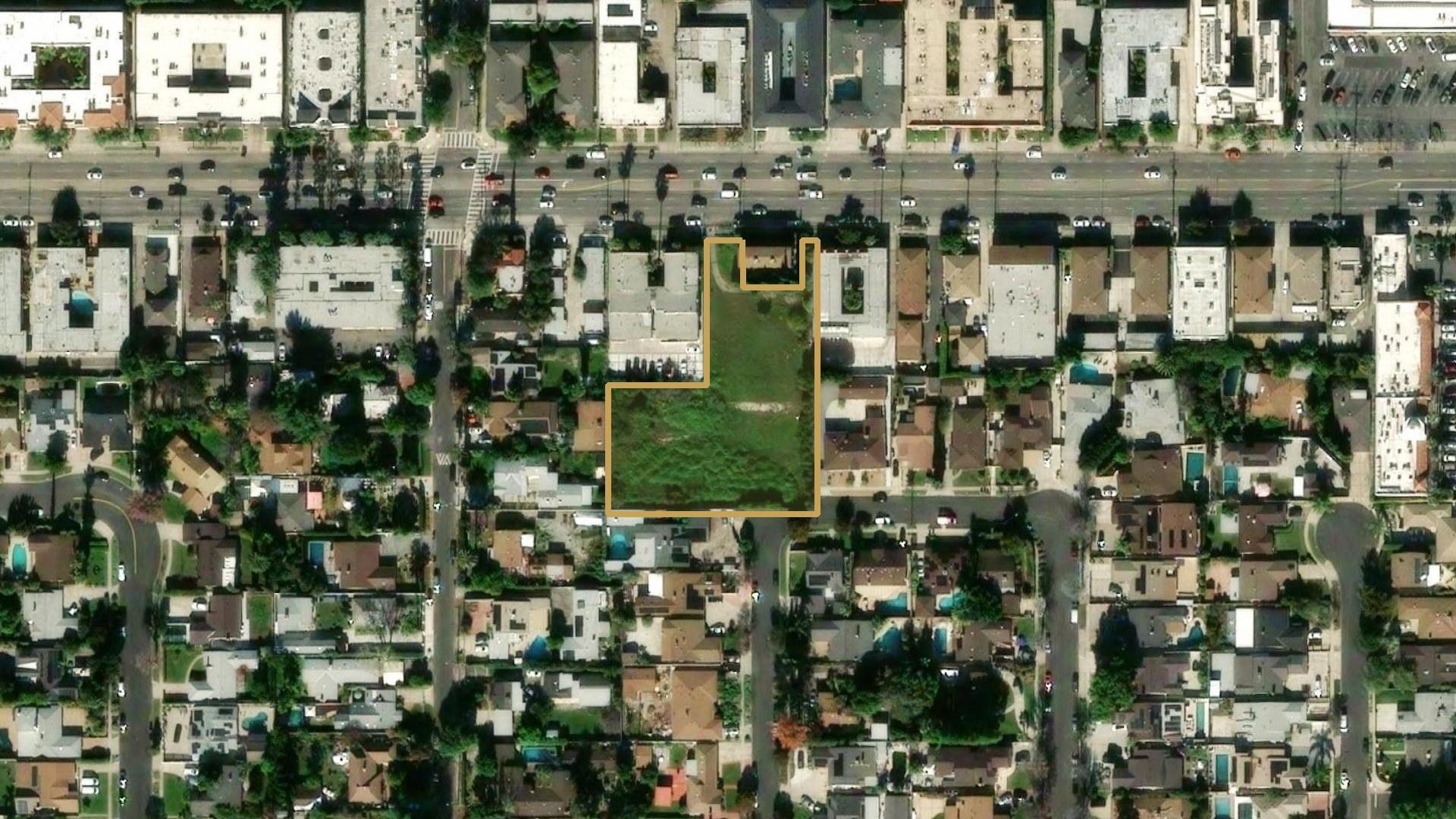 Overhead aerial of the vacant 1.05-acre site at 13840 Sherman Way with the parcel outlined